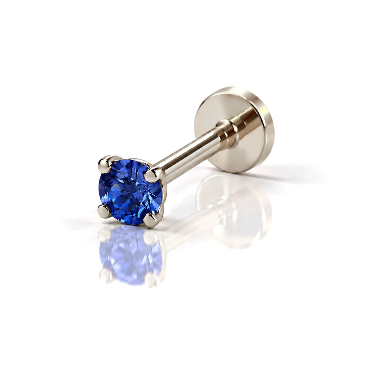 June Griffe Deep Blue piercing in white titanium