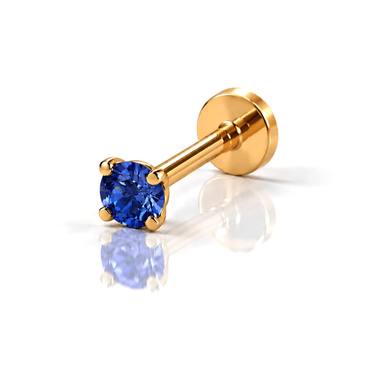 June Griffe Deep Blue piercing in yellow titanium
