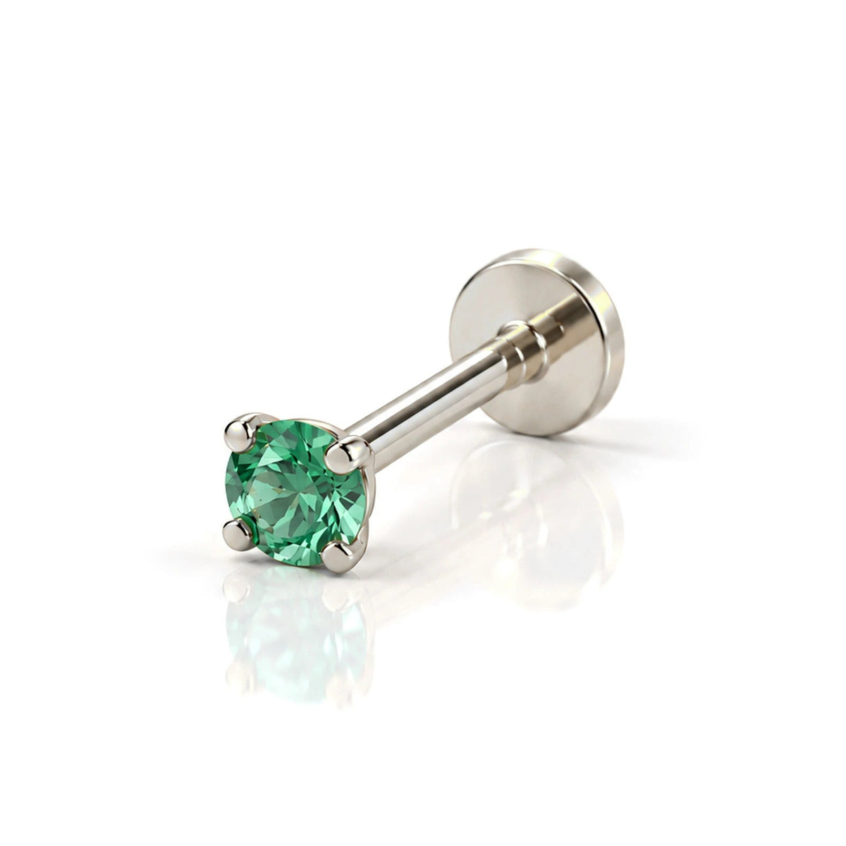 June Griffe Emerald Green piercing in white titanium