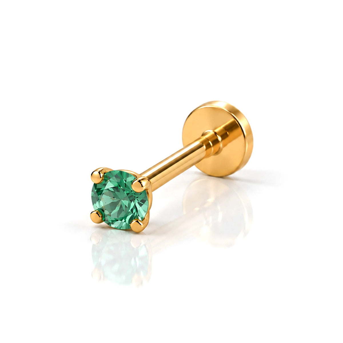 June Griffe Emerald Green piercing in yellow titanium