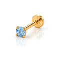 June Griffe Royal Blue piercing in yellow titanium