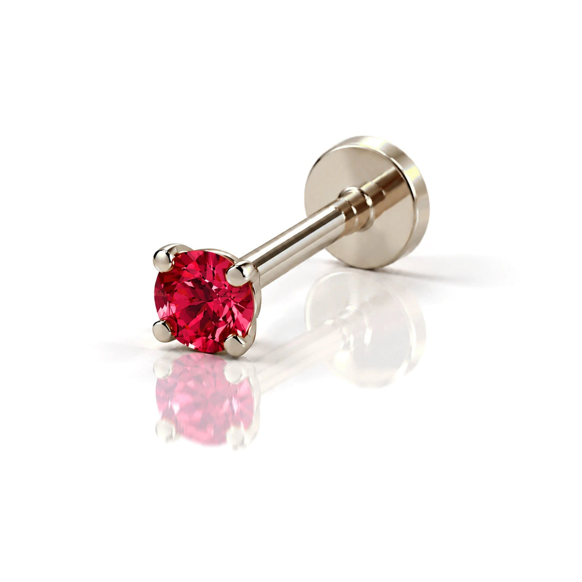 June Griffe Ruby Red piercing in white titanium